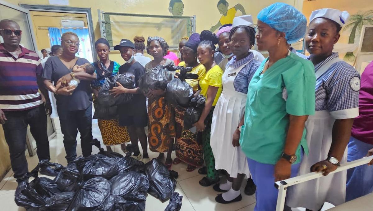 Rameses Sendolo (in black cap), CEO, Global Impact Gear, with officials and patients at Redemption Hospital